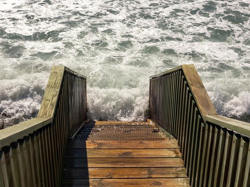 beach stairs and high tide